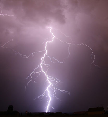 Close-up of lightning strike in night sky